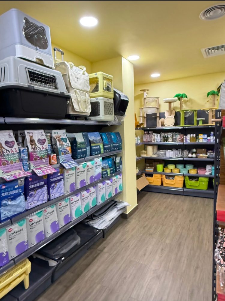 Aisle with pet supplies, carriers and cat trees